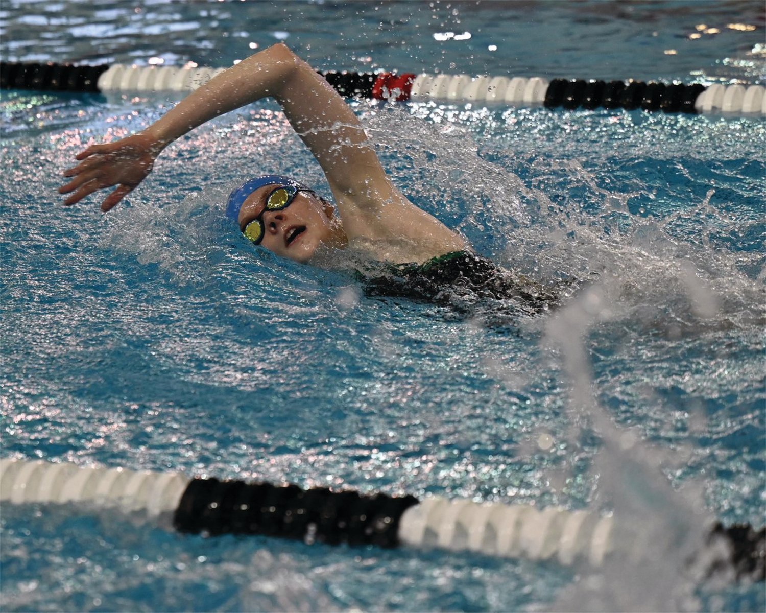 BIG RACE: Cranston East swimmer Ruby Houle competes in a relay race last week at the Rhode Island Interscholastic League Swimming State Championships. Houle had a strong outing and was a member of the team’s relay group that took 11th in the 400 free relay race. (Photos by Leo van Dijk/rhodyphoto.zenfolio.com)